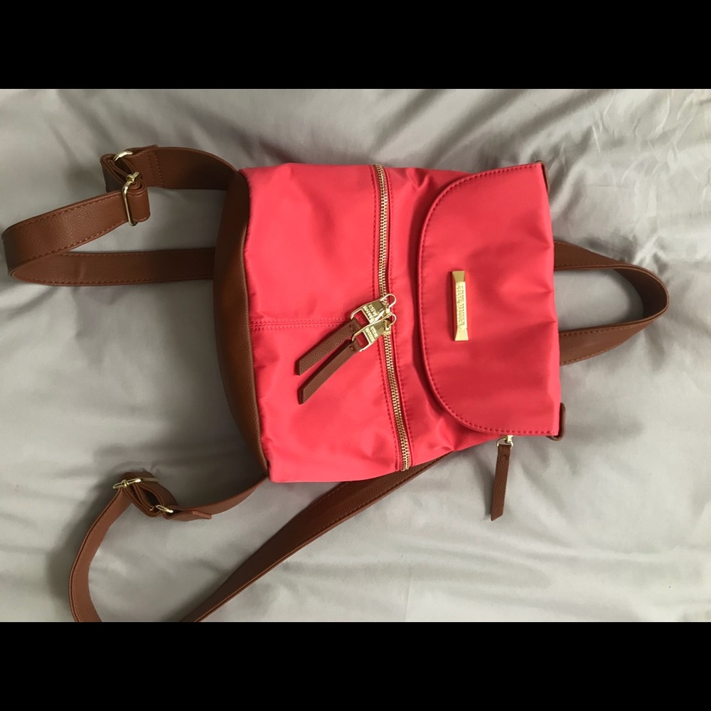 Raspberry/Pink colored bag, backpack